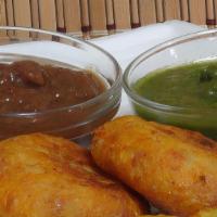 Aloo Tikki · Seasoned potatoes and peas, fried in chickpea batter.