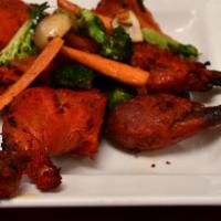 Tandoori Chicken Tikka · Chunks of boneless chicken breast marinated in freshly ground spices with saffron.