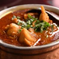 Vindaloo · Choice of Meat, onion, vinegar, potatoes, ginger, spices and chili peppers all go into makin...