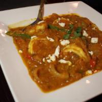 Shrimp Bhuna · A fairly dry fried curry containing Jumbo Shrimp, onion, bell peppers, and around a dozen In...
