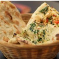 Naan · Naan, the most popular Indian bread. Baked in the clay oven; tandoor, tastes HEAVENLY. The t...