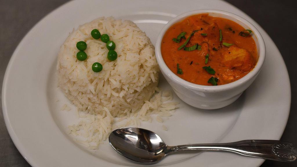Chicken Tikka Masala · Fire-roasted chicken cooked with sliced onion and bell peppers, with tomato sauce and a touch of cream.
