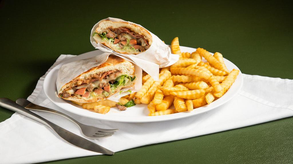 Torta With Fries · Beans, cheese, lettuce, tomatoes, sour cream and guacamole.