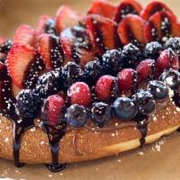 Ajarski Khachapuri With Nutella/Fruit · A baked bread with a load of Nutella, topped with various fruit, sprinkled with powdered sug...