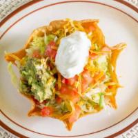 Taco Salad · Choice of meat served in a deep-fried flour tortilla bowl. Topped with lettuce, cheese, and ...