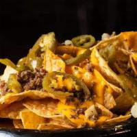Nachos · CHIPS, NACHO CHEESE AND JALAPENOS