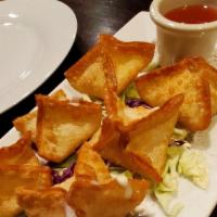 Cheese Wonton · Fried wonton skin stuffed with cream cheese served with sweet and source.
