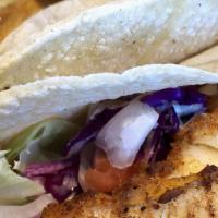 Fish Tacos · Two tacos with two corn tortillas each, grilled cod and shredded iceberg lettuce, tomatoes, ...