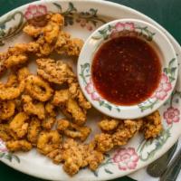 Fried Calamari · Served with your choice of pico de gallo, raspberry chipotle sauce, sweet chili sauce or coc...
