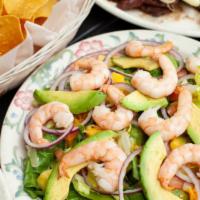 Puerto Vallarta Salad · Gluten-free. Cooked shrimp, spinach, romaine lettuce, cucumber, tomato, red onion, orange, s...