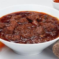 Key Sega Wat (Spicy Beef Stew) · Tender beef cubes simmered in spicy berbere (chili powder) sauce and onion, flavored with va...