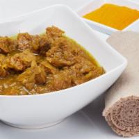 Yebeg Alicha Sega Wat (Mild Lamb Stew) · Lamb cubes simmered in mild sauce, kibbeh (spiced clarified butter), onion and turmeric.