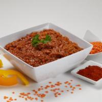 Misir Wat (Medium Spicy Red Split Lentils) · Red split lentils cooked with onion, berbere (chili powder) sauce and herbs.