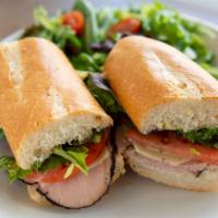 Ham & Swiss Cold Panini · Sliced of Black Forest Ham, Mixed Greens, Swiss Cheese, Mustard, Mayo on Baguette. Served wi...