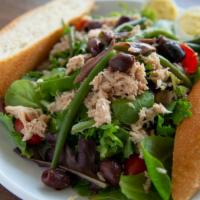 Nicoise · Mixed Greens, Green Beans, Black Olives, Albacore Tuna tossed on Balsamic Vinaigrette. Toppe...