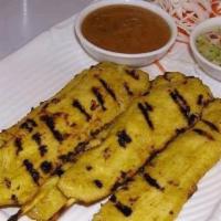 A6 Chicken Sa-Tay · Tender and succulent chicken strips marinated in Thai Satay sauce. Skewered and grilled on t...