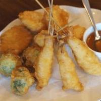 A4 Shrimp Tempura · Light battered shrimp and broccoli crispy fried and served with our homemade Thai sweet and ...