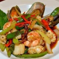 67 Pad Char Seafood · Shrimp,squid,scallop and mussel stir fried with onion,basil in chili paste.