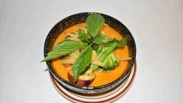 55 Red Curry · Your choice cooked in Thai red curry with sweet basil leaves, eggplants, bamboo shoots and bell peppers.