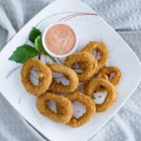Calamari · Battered and Deep-fried crispy calamari rings, served with spicy aioli.