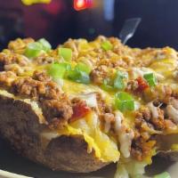 Sloppy Joe · Huge Tater Smothered with ground Beef, Sloppy Joe Sauce, Tater Butter, Green Onion, and Ched...