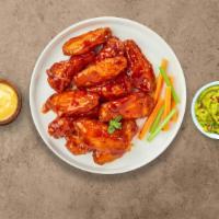 Brawny Buffalo Wings · Fresh chicken wings fried until golden brown, and tossed in hot buffalo sauce. Served with a...