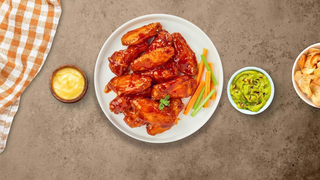 Brawny Buffalo Wings · Fresh chicken wings fried until golden brown, and tossed in hot buffalo sauce. Served with a side of ranch or bleu cheese.