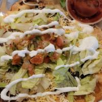 Frybread Supreme  · Choice Of Meat: Shredded Beef, Shredded Chicken,  Carne Asada, Red Chile Meat, Toppings: Let...