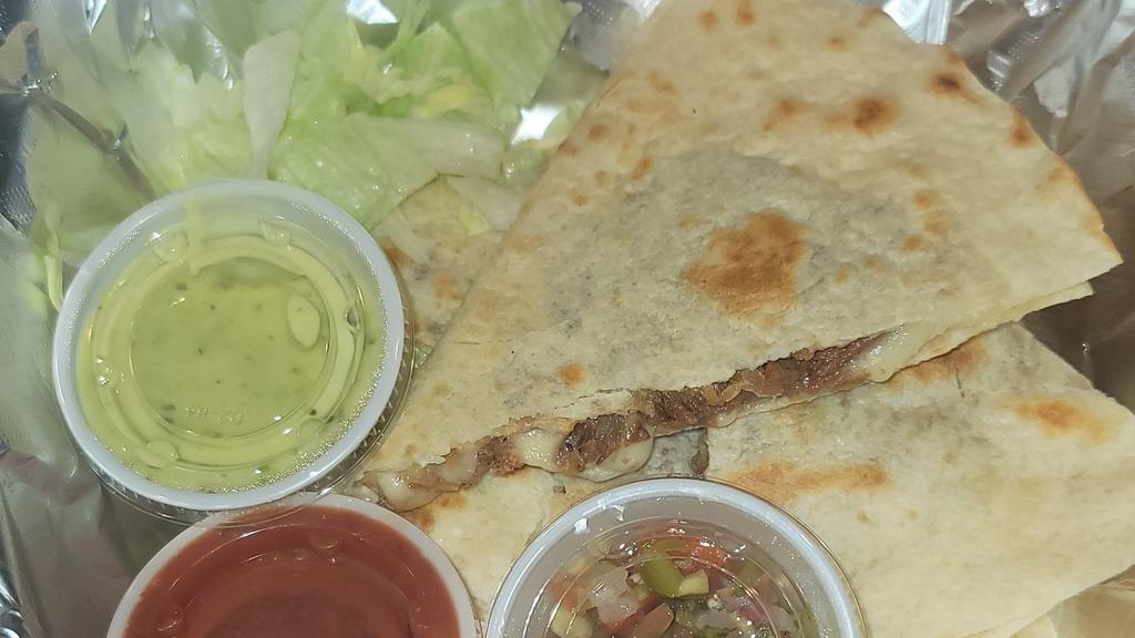 Quesadilla Plate · 1 Quesadilla Choice Of Flour Or Corn Tortilla. Choice of Meat Shredded Beef or Carne Asada, Chicken, or Just cheese,Salsa, lettuce, Pico de Gallo, Guacamole for an additional charge. Served with Rice and Beans.