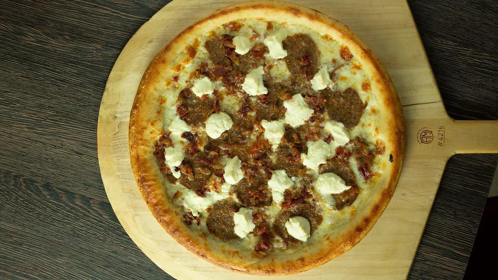 Bacon Baller · White pie with crumbled homemade meatballs, bacon, and ricotta.