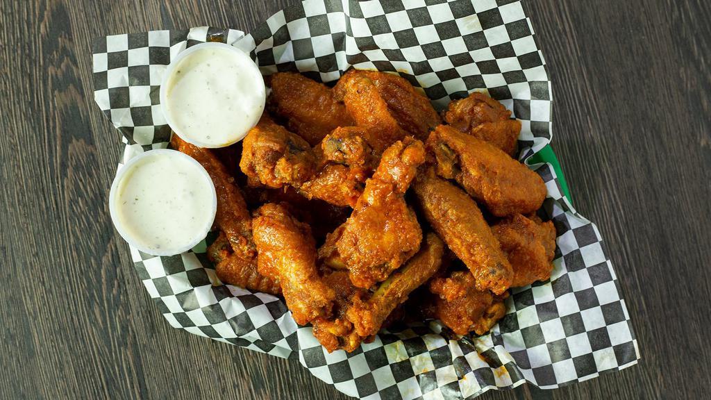Wings · Your choice classic bone-in or boneless double deep fried to perfection, with your choice of sauce and dressing.