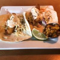 Fish Taco · Your choice of flour or corn tortilla filled with battered or grilled oregon rockfish, slaw,...