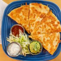 Quesadilla With Choice Of Protein · House made flour tortilla filled with your choice of protein and oaxaca cheese. Served with ...