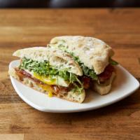 Lovejoy Deluxe · Fried egg with Oregon bleu cheese, bacon, and frisée with tarragon vinaigrette on ciabatta r...
