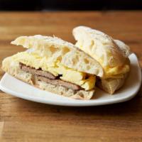 Scrambled Egg · Scrambled egg with ham, bacon or sausage, and butter on ciabatta roll.