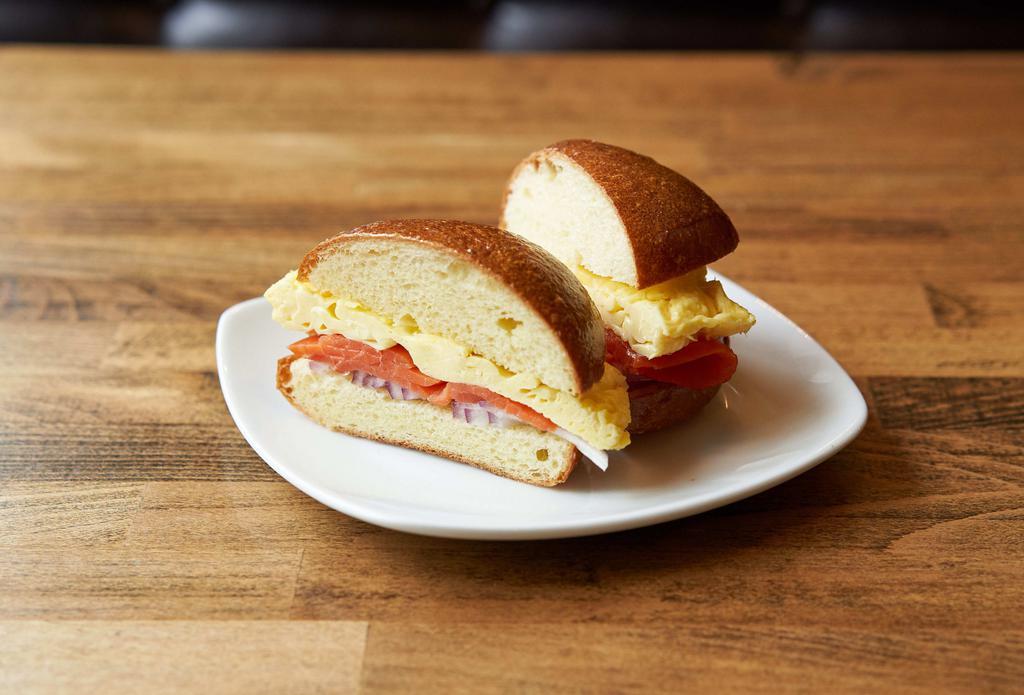 Lox Sandwich · Scrambled eggs and lox served with red onion on a buttered ciabatta roll.