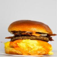 Big Breakfast Brioche Sammy · 2 fresh cracked cage-free scrambled eggs, melted Cheddar cheese, bacon, breakfast sausage, g...