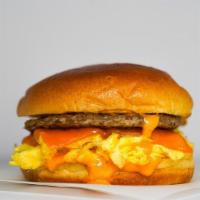 Sausage, Egg And Cheddar Brioche Sandwich · 2 fresh cracked cage-free scrambled eggs, melted Cheddar cheese, breakfast sausage, and Srir...