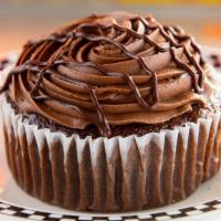 Triple Fudge Lust Xxx Jumbo Cupcake · Moist chocolate cake with chocolate frosting and dripped with ganache.