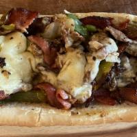 Bacon Galore Cheesesteak  · Steak, Bacon, American Cheese, Caramelized Onions, Green Peppers, Mushrooms, Fresh Hoagie Ro...