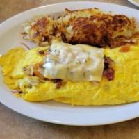 Mexican Omelet · Beef, chorizo, salsa, bell pepper, onions, green chile, topped with cheese.