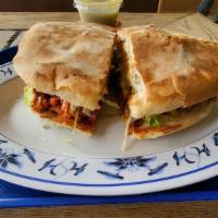 Torta · Our special Mexican sandwich made with beans, your choice of meat, lettuce, tomatoes, guacam...