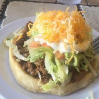 Sopes · Handmade masa patties topped with beans, your choice of meat, lettuce, tomatoes, sour cream,...