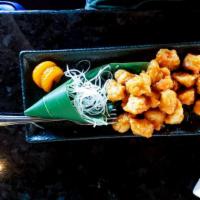 Orange Chicken · Diced chicken breast, coated with tempura and served with a sweet chili, soy and fresh orang...