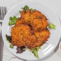 Macadamia Chicken Strips · Tender macadamia nut-crusted chicken breasts served with sweet and sour chili sauce.