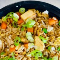 Fried Rice · Jasmine rice, eggs, green peas, carrots, garlic, soy sauce and garnish with scallion.