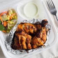 Tandoori Chicken Tikka · 2 Chicken quarter pieces marinated in special herbs and spices, baked in clay oven, presente...
