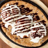 Chocolate Chip Skillet Cookie · Chocolate Chip Cookie, Vanilla Bean Ice Cream, Chocolate Sauce.