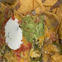 Agave Azul Nachos · Favorite. A delightful quarter corn tortilla deep-fried until crispy golden and topped with ...
