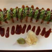 Caterpillar Roll · Inside the roll includes fresh eel avocado and crab with sliced avocado on the top with swee...